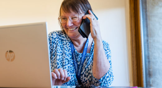 volunteer answering calls to the Alzheimer's Society helpline